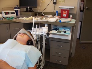 Woman that is relaxing in a dental chair receiving laughing gas. 